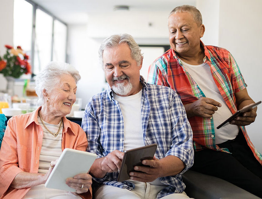 Happy Elders looking at life insurance quotes